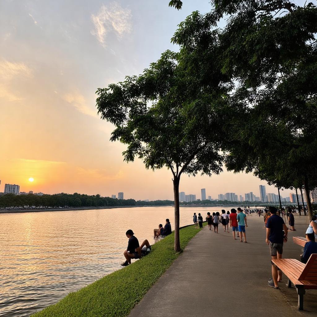 Khung cảnh hoàng hôn thơ mộng nhìn từ công viên ra sông Sài Gòn, có người đang ngắm cảnh.