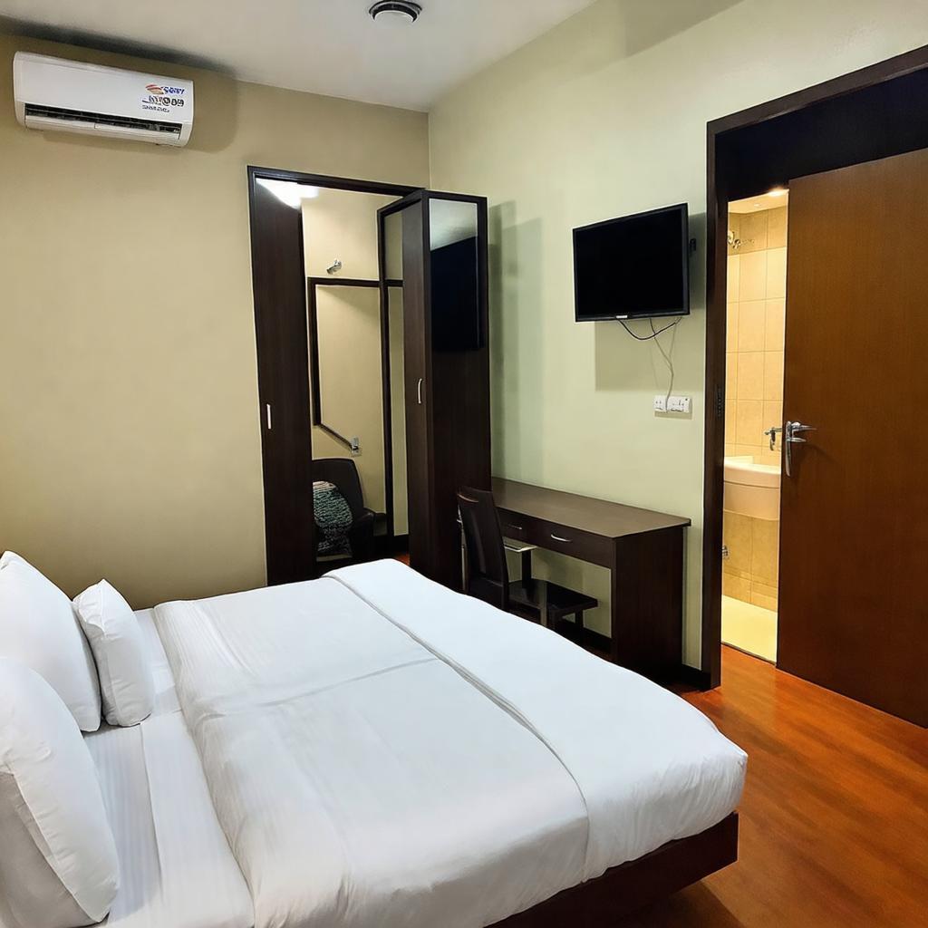 Bên trong một phòng nghỉ tiêu chuẩn tại khách sạn SPOT ON 905 Nguyệt Đức với tiện nghi cơ bản.