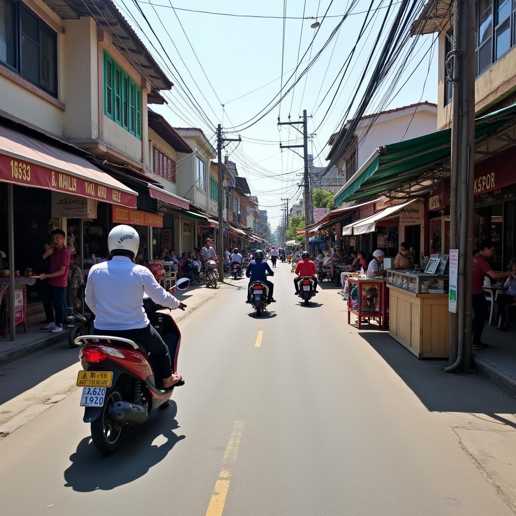 Toan canh mot goc duong pho nhon nhip tai Phuong Rach Dua, Vung Tau voi nhieu hang quan va xe co qua lai