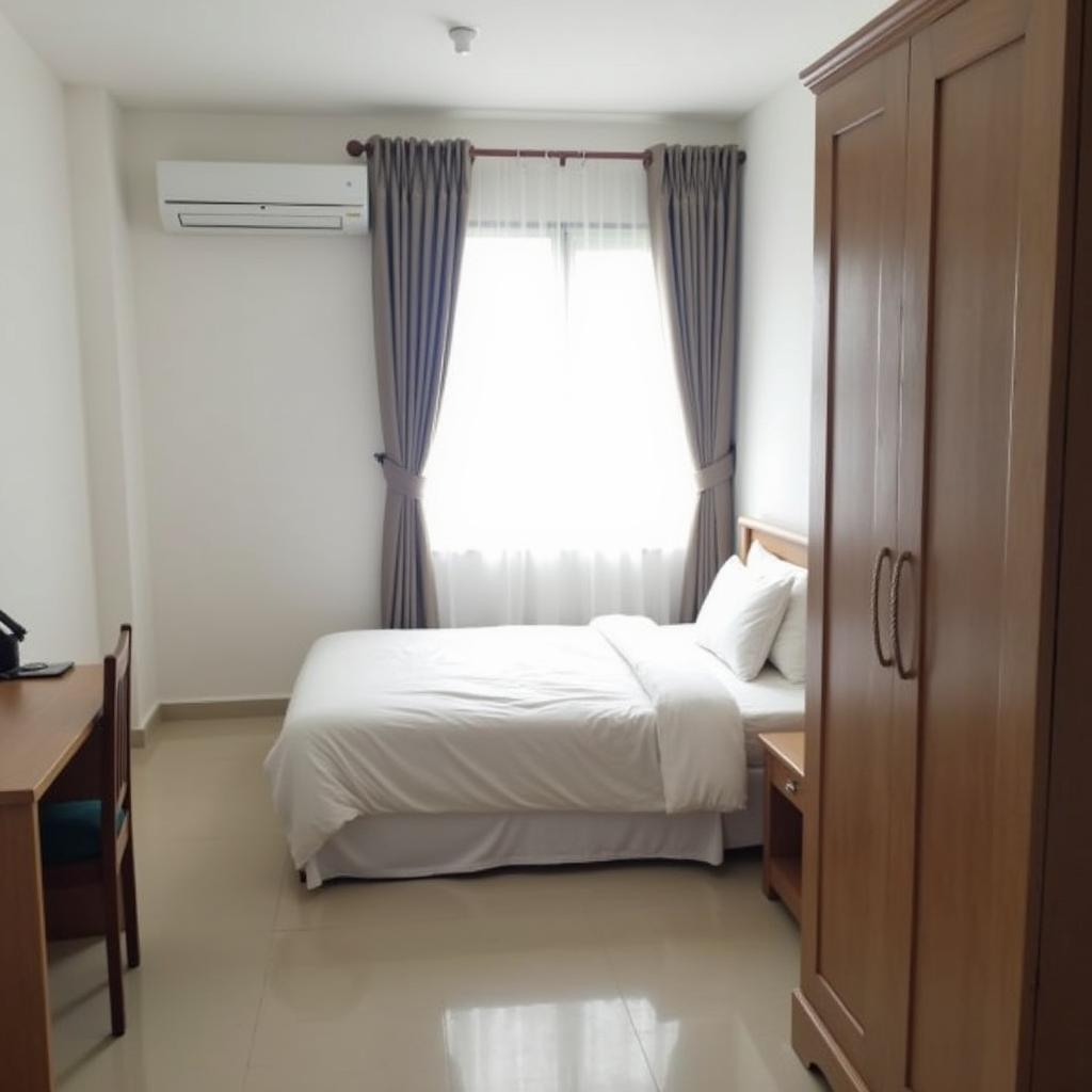 Nội thất phòng nghỉ đơn giản tại Khách sạn Cẩm Hà Cà Mau