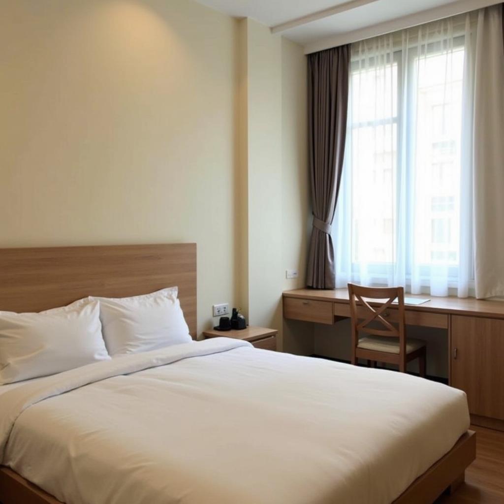 Bên trong một phòng nghỉ tiêu chuẩn tại Khách sạn Ngọc Thanh, Bình Thạnh với đầy đủ tiện nghi cơ bản cho du khách