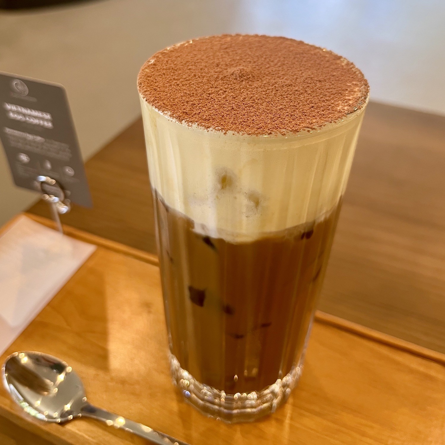Cocoa dusting atop egg coffee 