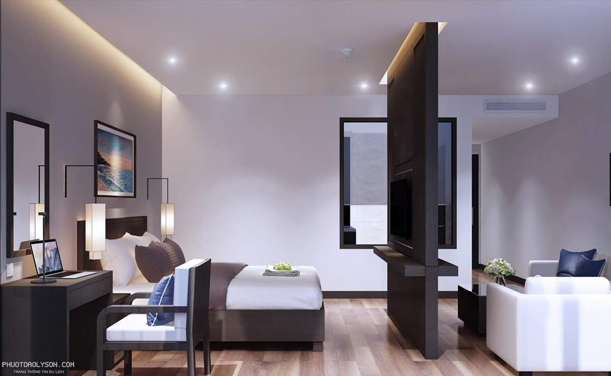 Giường ngủ tiện nghi trong phòng Premium Ocean View, hướng ra cửa sổ lớn với view biển tuyệt đẹp tại Đảo Ngọc Lý Sơn.