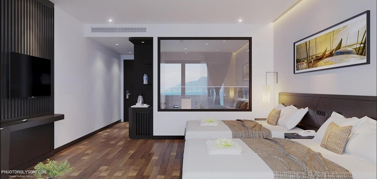 Không gian phòng Suite với hai giường đơn, bàn làm việc và tủ quần áo, tiện nghi cho gia đình tại Ly Son Pearl Island Hotel &amp; Resort.