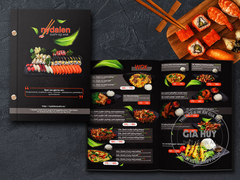 Một dãy sushi đầy màu sắc đặt trên nền tối, làm nổi bật độ tươi ngon của món ăn trong menu nhà hàng Nhật