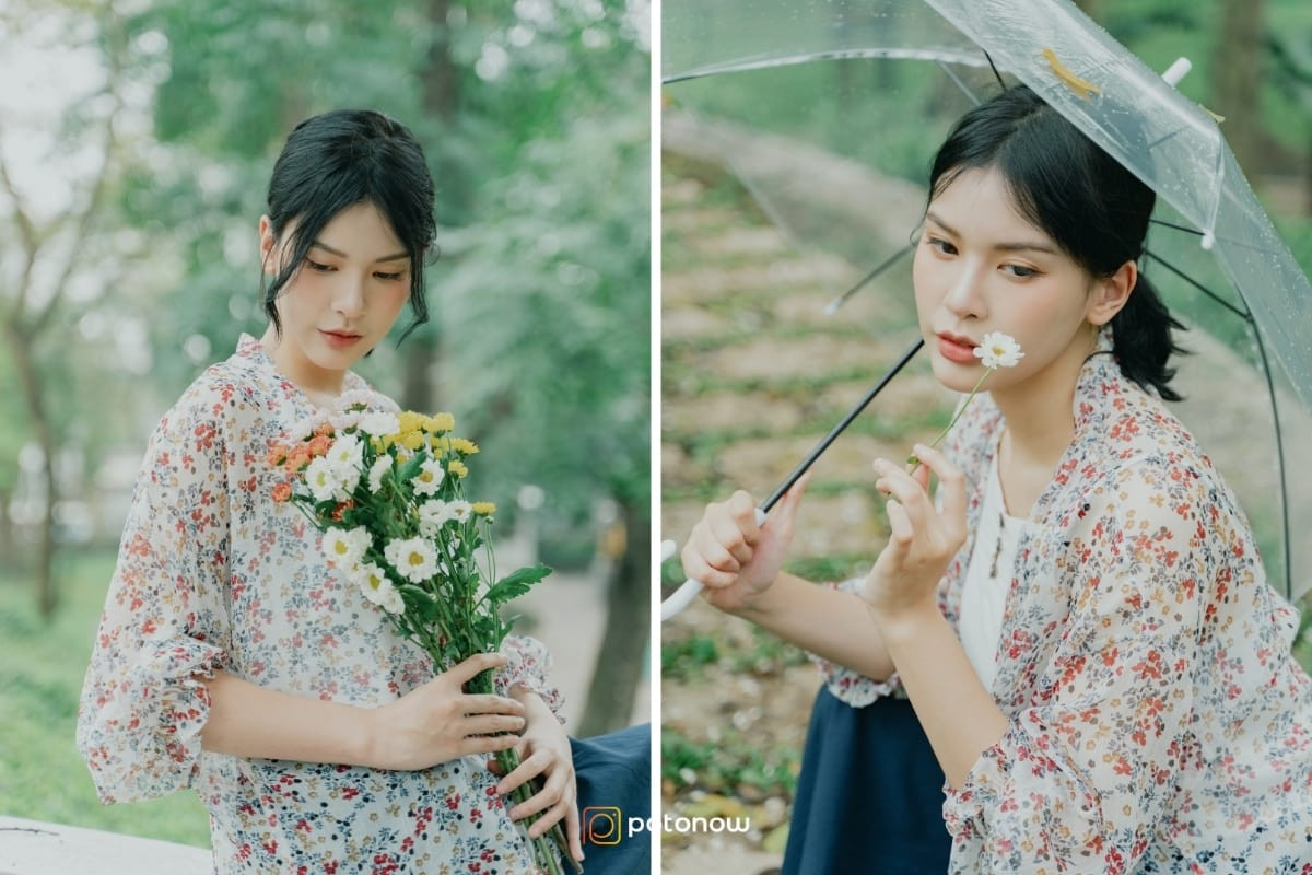 Một cô gái mặc váy vàng, đội mũ rộng vành, ngồi giữa luống hoa cúc trắng vàng, quay lưng về phía ống kính, tay chạm nhẹ vào hoa, tạo dáng chụp ảnh ở vườn hoa với tư thế ngồi