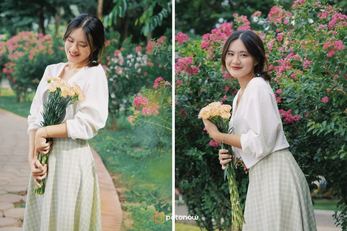 Một cô gái mặc váy vàng, đội mũ rộng vành, ôm bó hoa cúc họa mi lớn trên tay, hơi nghiêng người, tạo dáng chụp ảnh đẹp ở vườn hoa với vẻ duyên dáng và nữ tính