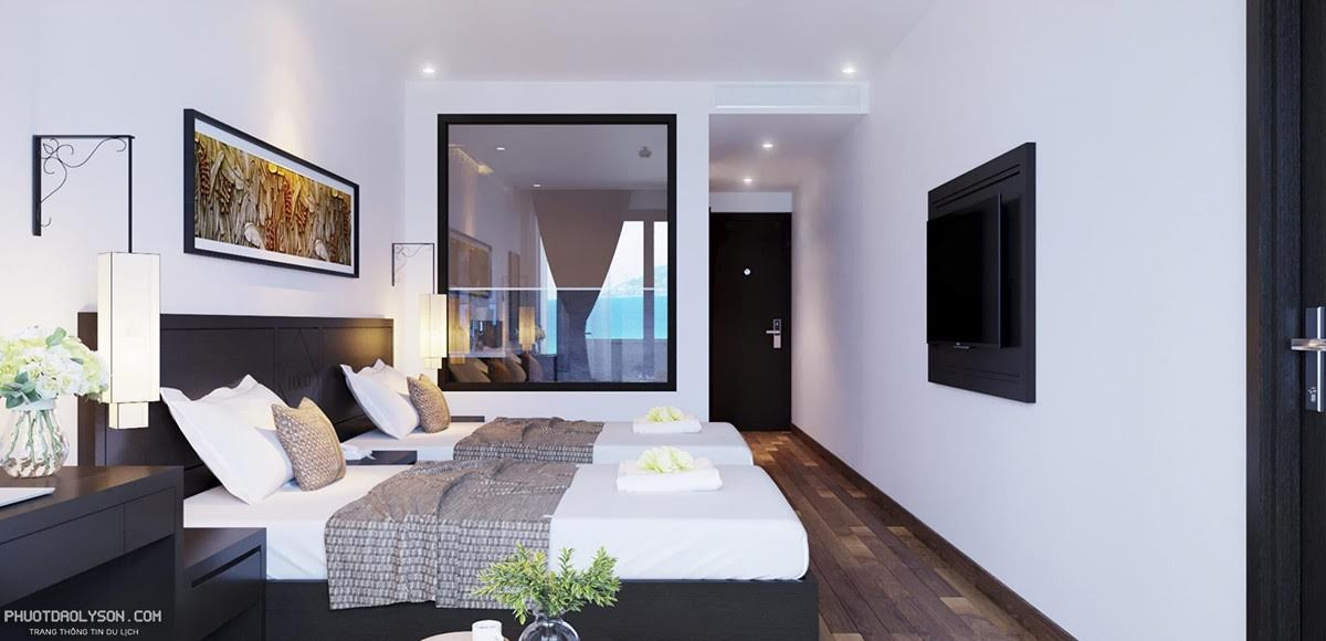 Phòng Deluxe Ocean and Garden View với không gian rộng rãi, hai giường đơn, và thiết kế nội thất hiện đại tại khách sạn Đảo Ngọc Lý Sơn.
