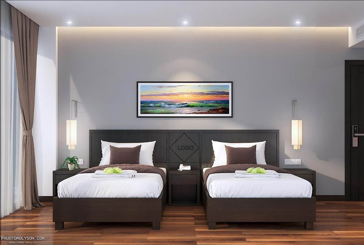 Phòng Suite Family Ocean and Pool View với không gian rộng rãi, giường đôi, và tầm nhìn ra biển và hồ bơi của khách sạn Đảo Ngọc Lý Sơn.