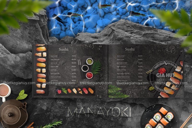 Menu sushi kết hợp với phụ kiện như đũa, tách trà Nhật, lá xanh